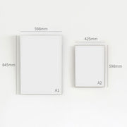 淡いベージュとピンクを基調とした幾何学模様のアートポスターとアルミフレーム