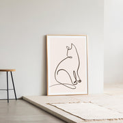 KANADEMONOの猫のおすわりをモチーフにしたモダンなドローイングアートA１＋ゴールドフレーム（エントランス使用例）